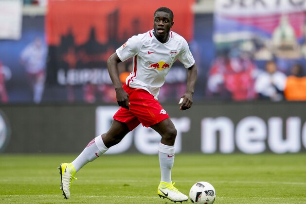Leipzig´s French defender Dayot Upamecano plays the ball during the German first division Bundesliga football match between RB Leipzig and FC Ingolstadt 04 in Leipzig, eastern Germany on April 29, 2017.  / AFP PHOTO / ROBERT MICHAEL / RESTRICTIONS: DURING MATCH TIME: DFL RULES TO LIMIT THE ONLINE USAGE TO 15 PICTURES PER MATCH AND FORBID IMAGE SEQUENCES TO SIMULATE VIDEO. == RESTRICTED TO EDITORIAL USE == FOR FURTHER QUERIES PLEASE CONTACT DFL DIRECTLY AT + 49 69 650050
        (Photo credit should read ROBERT MICHAEL/AFP/Getty Images)