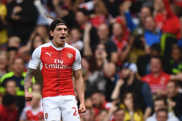 Arsenal's Spanish defender Hector Bellerin celerbates scoring their opening goal during the English Premier League football match between Arsenal and Everton at the Emirates Stadium in London on May 21, 2017.  / AFP PHOTO / Justin TALLIS / RESTRICTED TO EDITORIAL USE. No use with unauthorized audio, video, data, fixture lists, club/league logos or 'live' services. Online in-match use limited to 75 images, no video emulation. No use in betting, games or single club/league/player publications.  /         (Photo credit should read JUSTIN TALLIS/AFP/Getty Images)