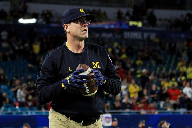 MIAMI GARDENS, FL - DECEMBER 30:  Head coach Jim Harbaugh of the Michigan Wolverines looks on prior to their Capitol One Orange Bowl game against the Florida State Seminoles at Sun Life Stadium on December 30, 2016 in Miami Gardens, Florida.  (Photo by Mike Ehrmann/Getty Images)