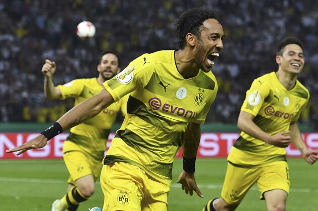 Dortmund's Gabonese forward Pierre-Emerick Aubameyang (C) celebrates after scoring a penalty goal during the German Cup (DFB Pokal) final football match Eintracht Frankfurt v BVB Borussia Dortmund at the Olympic stadium in Berlin on May 27, 2017. / AFP PHOTO / Christof Stache / RESTRICTIONS: ACCORDING TO DFB RULES IMAGE SEQUENCES TO SIMULATE VIDEO IS NOT ALLOWED DURING MATCH TIME. MOBILE (MMS) USE IS NOT ALLOWED DURING AND FOR FURTHER TWO HOURS AFTER THE MATCH. == RESTRICTED TO EDITORIAL USE == FOR MORE INFORMATION CONTACT DFB DIRECTLY AT +49 69 67880

 /         (Photo credit should read CHRISTOF STACHE/AFP/Getty Images)
