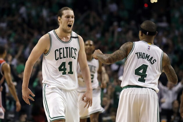 Boston Celtics center Kelly Olynyk (41) celebrates his basket with guard Isaiah Thomas (4) during the fourth quarter of Game 7 of a second-round NBA basketball playoff series against the Washington Wizards, Monday, May 15, 2017, in Boston. (AP Photo/Charles Krupa)