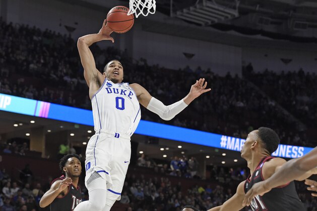 Duke's Jayson Tatum (0) goes to the basket against Troy during the first half in a first-round game of the NCAA men's college basketball tournament in Greenville, S.C., Friday, March 17, 2017. (AP Photo/Rainier Ehrhardt)