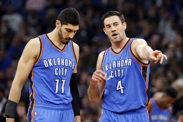 Oklahoma City Thunder's Enes Kanter, left, of Turkey, and Nick Collison confer during the second half of an NBA basketball game against the Minnesota Timberwolves Tuesday, April 11, 2017, in Minneapolis. (AP Photo/Jim Mone)