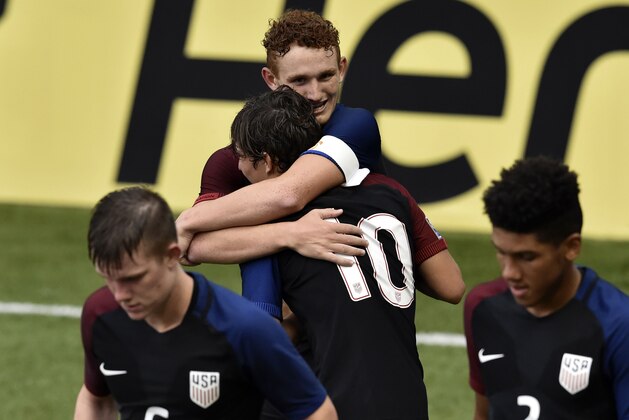 US's footballer Josh Sargent (C) celebrate with temmate after scoring against Honduras during their Under-17 Concacaf qualifying football match at the Maracana stadium on May 3, 2017 in Panama City. / AFP PHOTO / RODRIGO ARANGUA        (Photo credit should read RODRIGO ARANGUA/AFP/Getty Images)