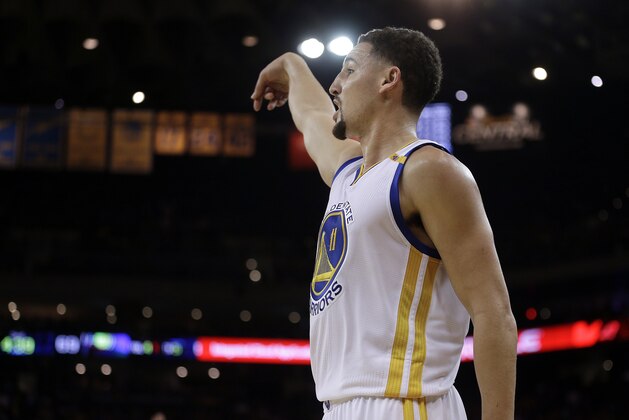 Golden State Warriors' Klay Thompson follows through on a shot during the third quarter of an NBA basketball game against the Indiana Pacers Monday, Dec. 5, 2016, in Oakland, Calif. (AP Photo/Ben Margot)