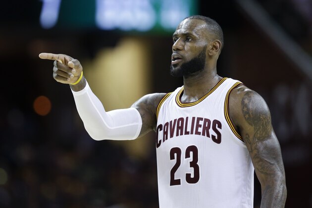 Cleveland Cavaliers' LeBron James (23) points against the Boston Celtics during the second half of Game 3 of the NBA basketball Eastern Conference finals, Sunday, May 21, 2017, in Cleveland. (AP Photo/Tony Dejak)