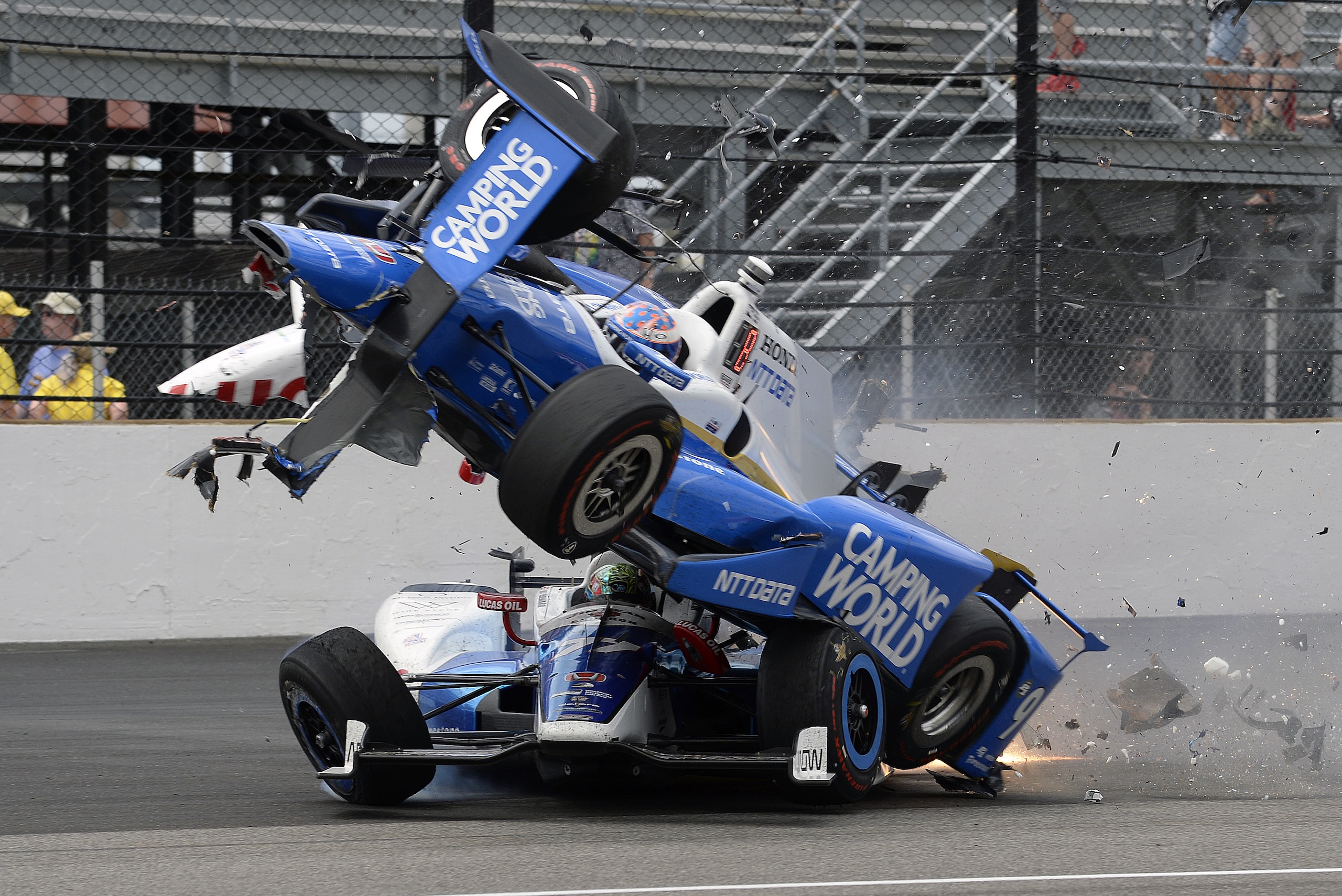 The car driven by Scott Dixon, of New Zealand, goes over the top of Jay Howard, of England, in the first turn during the running of the Indianapolis 500 auto race at Indianapolis Motor Speedway, Sunday, May 28, 2017, in Indianapolis. (AP Photo/Marty Seppala) The car driven by Scott Dixon, of New Zealand, goes over the top of Jay Howard, of England, in the first turn during the running of the Indianapolis 500 auto race at Indianapolis Motor Speedway, Sunday, May 28, 2017, in Indianapolis. (AP Photo/Marty Seppala)