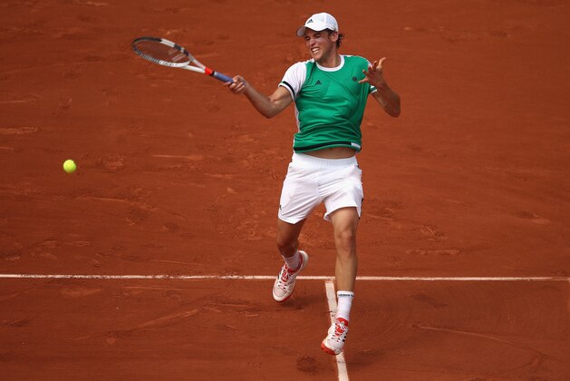 PARIS, FRANCE - MAY 28:  Dominic Thiem of Austria plays a forehand during the mens singles first round match against Bernard Tomic of Australia on day one of the 2017 French Open at Roland Garros on May 28, 2017 in Paris, France.  (Photo by Julian Finney/Getty Images)