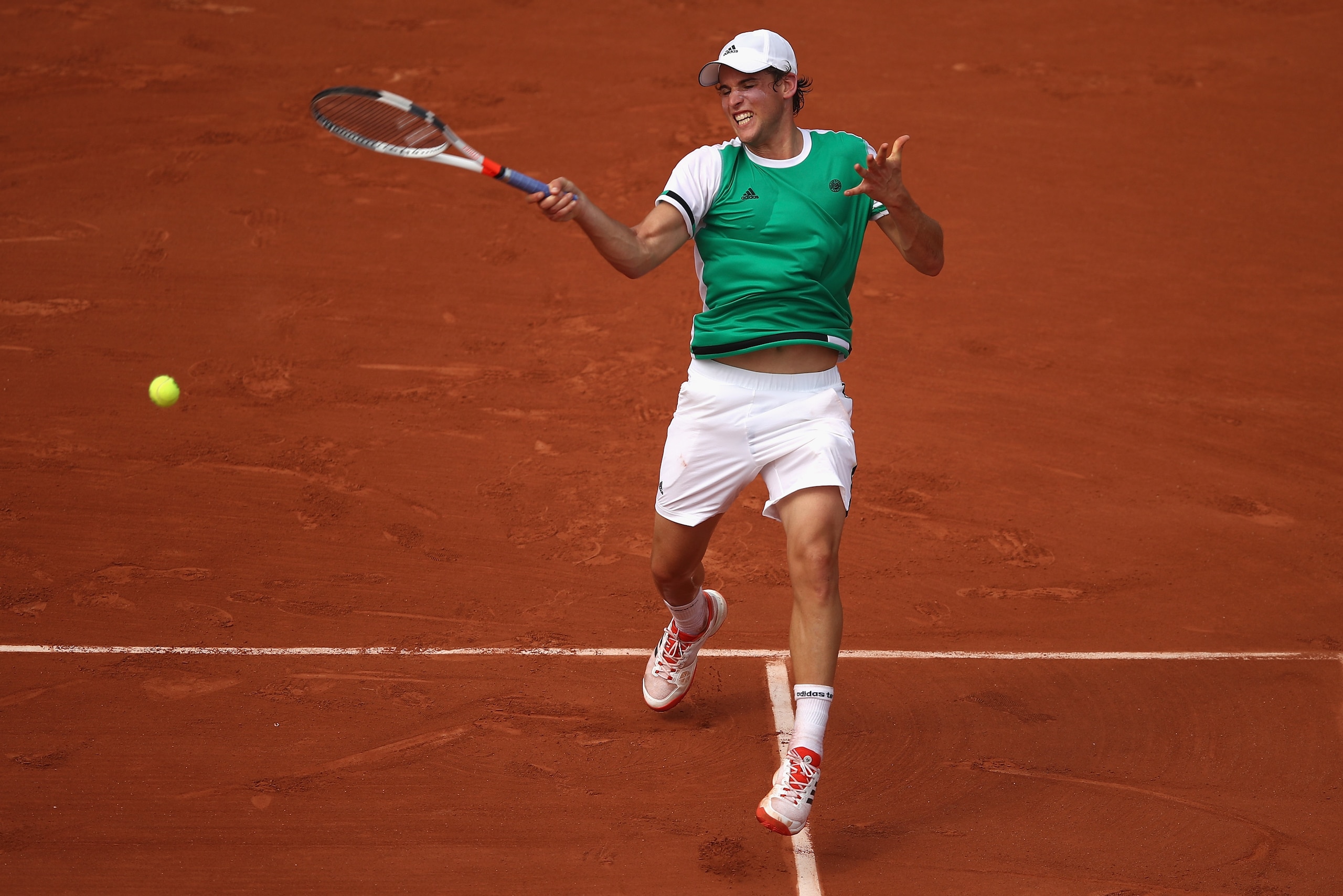 PARIS, FRANCE - MAY 28:  Dominic Thiem of Austria plays a forehand during the mens singles first round match against Bernard Tomic of Australia on day one of the 2017 French Open at Roland Garros on May 28, 2017 in Paris, France.  (Photo by Julian Finney/Getty Images)
