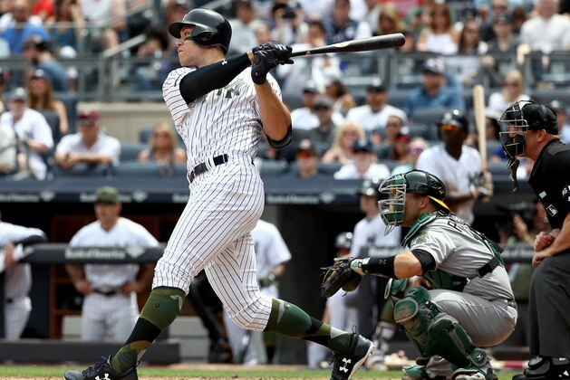 NEW YORK, NY - MAY 28:  Aaron Judge #99 of the New York Yankees hits a grand slam in the third inning as Josh Phegley #19 of the Oakland Athletics defends on May 28, 2017 at Yankee Stadium in the Bronx borough of New York City.  (Photo by Elsa/Getty Images)