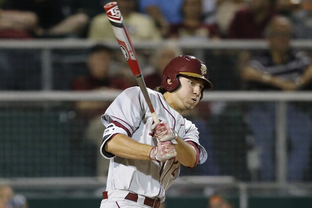 CORAL GABLES, FL - April 21: Drew Mendoza #22 of the Florida State Seminoles hits the ball against the Miami Hurricanes during fifth inning action on April 21, 2017 at Alex Rodriguez Park at Mark Light Field in Coral Gables, Florida. The Seminoles defeated the Hurricanes 6-3. (Photo by Joel Auerbach/Getty Images)