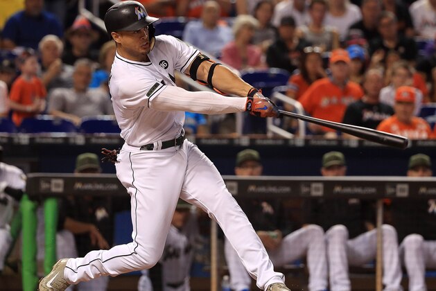 MIAMI, FL - MAY 28:  Giancarlo Stanton #27 of the Miami Marlins hits a solo home run in the first inning during a game against the Los Angeles Angels at Marlins Park on May 28, 2017 in Miami, Florida.  (Photo by Mike Ehrmann/Getty Images)