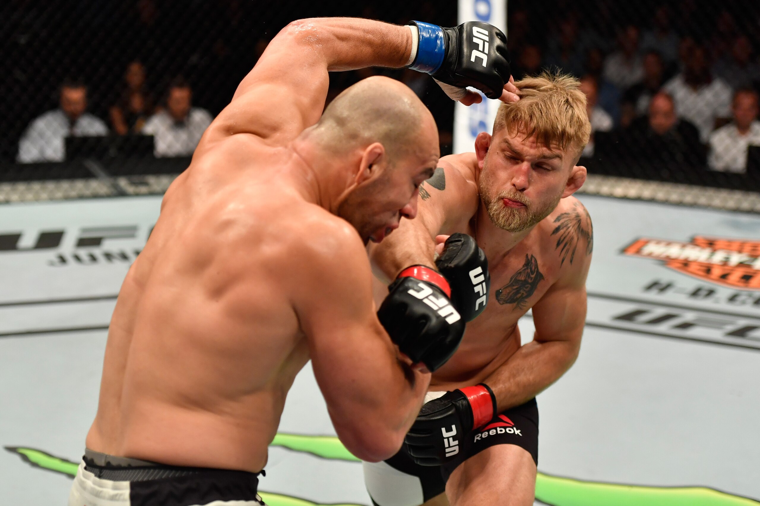 STOCKHOLM, SWEDEN - MAY 28:  (R-L) Alexander Gustafsson punches Glover Teixeira in their light heavyweight fight during the UFC Fight Night event at the Ericsson Globe Arena on May 28, 2017 in Stockholm, Sweden. (Photo by Jeff Bottari/Zuffa LLC/Zuffa LLC via Getty Images)
