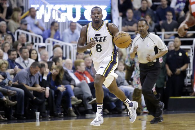 Utah Jazz guard Shelvin Mack (8) drives to the basket during the second half of an NBA basketball game against the Washington Wizards Friday, March 11, 2016, in Salt Lake City. The Jazz won 114-93. (AP Photo/Rick Bowmer)