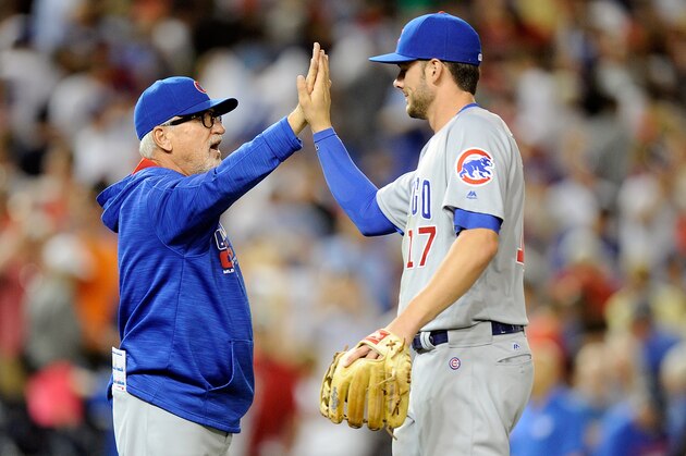 WASHINGTON, DC - JUNE 14:  Manager Joe Maddon #70 of the Chicago Cubs celebrates with Kris Bryant #17 after a victory against the Washington Nationals at Nationals Park on June 14, 2016 in Washington, DC.  (Photo by G Fiume/Getty Images)