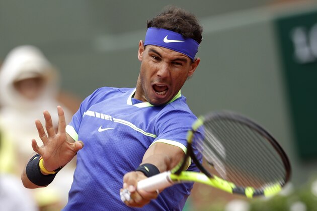 Spain's Rafael Nadal returns the ball to France's Benoit Paire during their first round match of the French Open tennis tournament at the Roland Garros stadium, Monday, May 29, 2017 in Paris. (AP Photo/Petr David Josek)