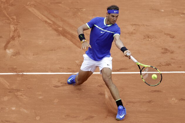 Spain's Rafael Nadal returns the ball to France's Benoit Paire during their first round match of the French Open tennis tournament at the Roland Garros stadium, Monday, May 29, 2017 in Paris. (AP Photo/Petr David Josek)