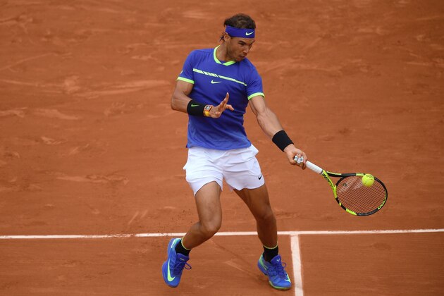 Spain's Rafael Nadal returns the ball to France's Benoit Paire during their tennis match at the Roland Garros 2017 French Open on May 29, 2017 in Paris.  / AFP PHOTO / Lionel BONAVENTURE        (Photo credit should read LIONEL BONAVENTURE/AFP/Getty Images)
