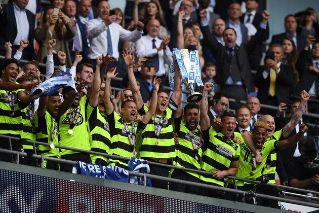 LONDON, ENGLAND - MAY 29:  Huddersield Town players celebrates promotion to the Premier League after the Sky Bet Championship play off final between Huddersfield and Reading at Wembley Stadium on May 29, 2017 in London, England.  (Photo by Gareth Copley/Getty Images)