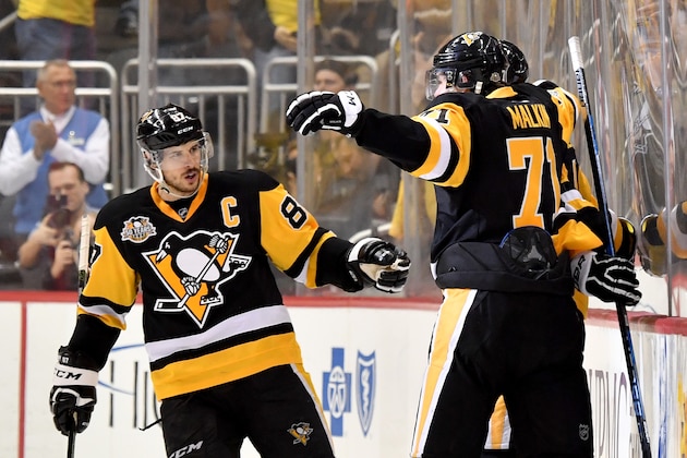 PITTSBURGH, PA - MAY 25:  Justin Schultz #4 of the Pittsburgh Penguins celebrates with his teammates Sidney Crosby #87 and Evgeni Malkin #71 after scoring a goal against Craig Anderson #41 of the Ottawa Senators during the third period in Game Seven of the Eastern Conference Final during the 2017 NHL Stanley Cup Playoffs at PPG PAINTS Arena on May 25, 2017 in Pittsburgh, Pennsylvania.  (Photo by Jamie Sabau/Getty Images)