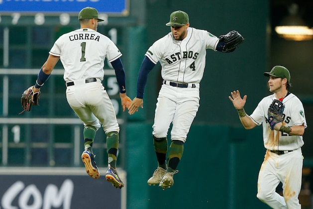 HOUSTON, TX - MAY 28:  Carlos Correa #1 and George Springer #4 of the Houston Astros celebrate as Josh Reddick #22 looks on after defeating the Baltimore Orioles at Minute Maid Park on May 28, 2017 in Houston, Texas.  (Photo by Bob Levey/Getty Images)