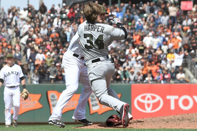 SAN FRANCISCO, CA - MAY 29:  Bryce Harper #34 of the Washington Nationals and Hunter Strickland #60 of the San Francisco Giants throw punches at one another after Strickland hit Harper with a pitch in the top of the eighth inning at AT&T Park on May 29, 2017 in San Francisco, California.  (Photo by Thearon W. Henderson/Getty Images)