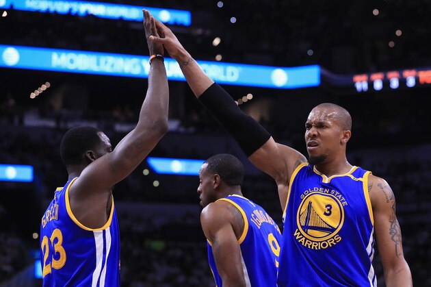SAN ANTONIO, TX - MAY 20:  David West #3 of the Golden State Warriors high fives Draymond Green #23 in the first half against the San Antonio Spurs during Game Three of the 2017 NBA Western Conference Finals at AT&T Center on May 20, 2017 in San Antonio, Texas. NOTE TO USER: User expressly acknowledges and agrees that, by downloading and or using this photograph, User is consenting to the terms and conditions of the Getty Images License Agreement.  (Photo by Ronald Martinez/Getty Images)