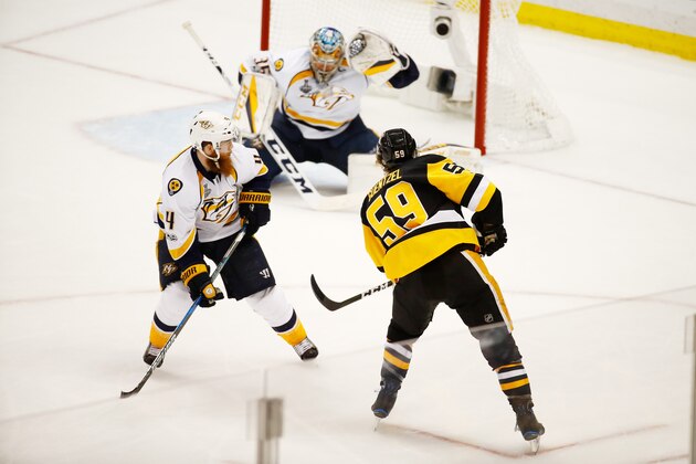 PITTSBURGH, PA - MAY 29:  Jake Guentzel #59 of the Pittsburgh Penguins shoots a goal as Pekka Rinne #35 of the Nashville Predators defends during the third period in Game One of the 2017 NHL Stanley Cup Final at PPG Paints Arena on May 29, 2017 in Pittsburgh, Pennsylvania.  (Photo by Gregory Shamus/Getty Images)