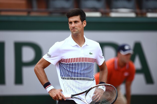 Serbia's Novak Djokovic reacts during his tennis match against Spain's Marcel Granollers at the Roland Garros 2017 French Open on May 29, 2017 in Paris.  / AFP PHOTO / GABRIEL BOUYS        (Photo credit should read GABRIEL BOUYS/AFP/Getty Images)