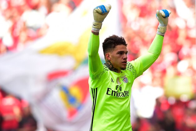 Benfica's Brazilian goalkeeper Ederson Moraes celebrates their second goal scored by teammate Mexican forward Raul Jimenez during the Portuguese league football match SL Benfica vs Vitoria Guimaraes SC at the Luz stadium in Lisbon on May 13, 2017. / AFP PHOTO / MIGUEL RIOPA        (Photo credit should read MIGUEL RIOPA/AFP/Getty Images)