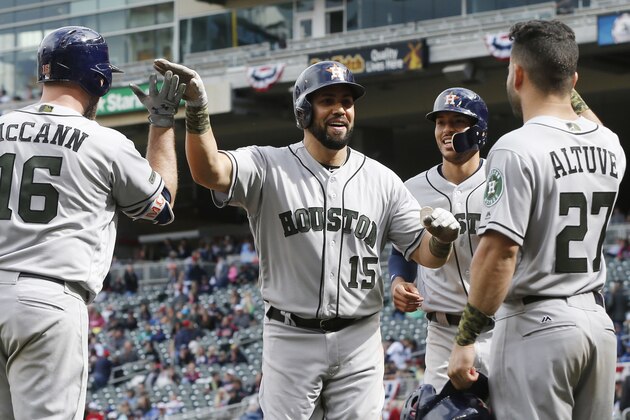 Houston Astros' Carlos Beltran, center, celebrates his three-run home run with teammates in the eighth inning of a baseball game against the Minnesota Twins Monday, May 29, 2017 in Minneapolis. The Astros won 16-8. (AP Photo/Jim Mone)
