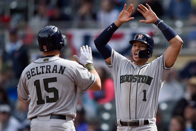 MINNEAPOLIS, MN - MAY 29: Carlos Correa #1 of the Houston Astros congratulates teammate Carlos Beltran #15 on a three-run home run against the Minnesota Twins during the eighth inning of the game on May 29, 2017 at Target Field in Minneapolis, Minnesota. The Astros defeated the Twins 16-8. (Photo by Hannah Foslien/Getty Images)