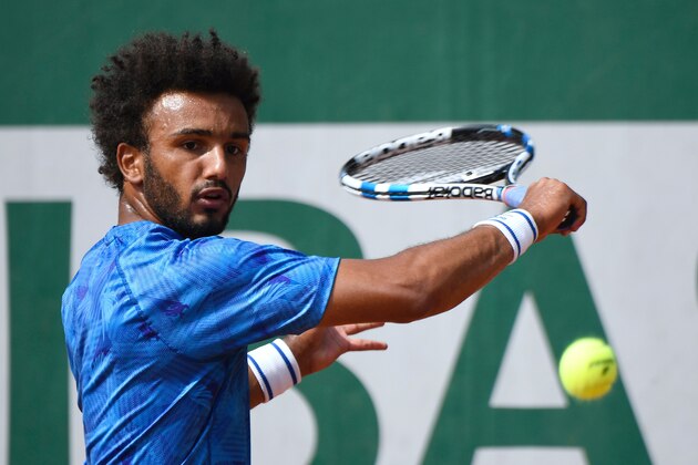 France's Maxime Hamou returns the ball to Uruguay's Pablo Cuevas during their tennis match at the Roland Garros 2017 French Open on May 29, 2017 in Paris.  / AFP PHOTO / Eric FEFERBERG        (Photo credit should read ERIC FEFERBERG/AFP/Getty Images)