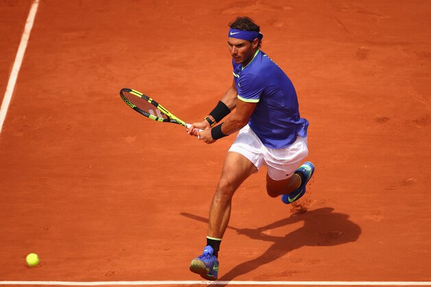 PARIS, FRANCE - MAY 29:  Rafael Nadal of Spain plays a backhand during the mens singles first round match against Benoit Paire of France on day two of the 2017 French Open at Roland Garros on May 29, 2017 in Paris, France.  (Photo by Clive Brunskill/Getty Images)
