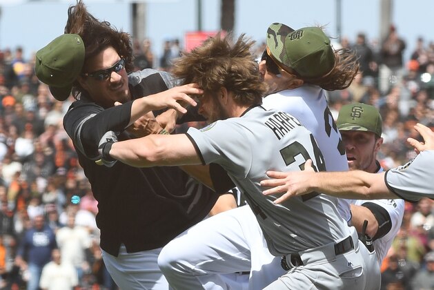 SAN FRANCISCO, CA - MAY 29:  Jeff Samardzija #29 of the San Francisco Giants goes after Bryce Harper #34 of the Washington Nationals after Harper charged the mound from being hit by a pitch from Hunter Strickland #60 in the top of the eighth inning at AT&T Park on May 29, 2017 in San Francisco, California. Giants Michael Morse #38 jumps in the middle as National's Daniel Murphy #20 tries to pull Harper away.  (Photo by Thearon W. Henderson/Getty Images)