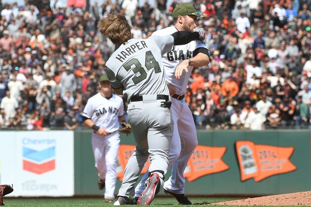 SAN FRANCISCO, CA - MAY 29:  Bryce Harper #34 of the Washington Nationals and Hunter Strickland #60 of the San Francisco Giants throw punches at one another after Strickland hit Harper with a pitch in the top of the eighth inning at AT&T Park on May 29, 2017 in San Francisco, California.  (Photo by Thearon W. Henderson/Getty Images)