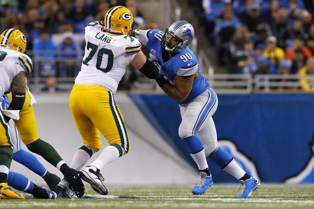 Detroit Lions defensive tackle Ndamukong Suh (90) rushes against Green Bay Packers guard T.J. Lang (70) during the second quarter of an NFL football game at Ford Field in Detroit, Thursday, Nov. 28, 2013. (AP Photo/Paul Sancya)