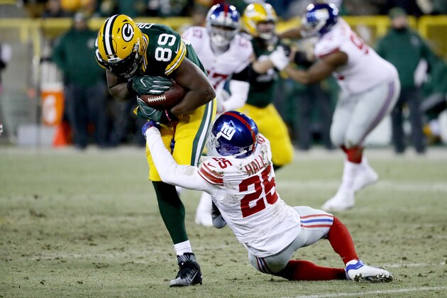 GREEN BAY, WI - JANUARY 8:  Leon Hall #25 of the New York Giants tackles Jared Cook #89 of the Green Bay Packers in the second quarter during the NFC Wild Card game at Lambeau Field on January 8, 2017 in Green Bay, Wisconsin.  (Photo by Jonathan Daniel/Getty Images)