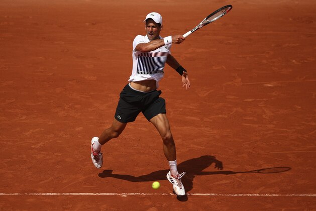PARIS, FRANCE - MAY 31:  Novak Djokovic of Serbia plays a forehand during the mens singles second round match against Joao Sousa of Portugal on day four of the 2017 French Open at Roland Garros on May 31, 2017 in Paris, France.  (Photo by Julian Finney/Getty Images)
