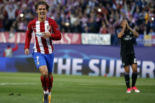 Atletico's Antoine Griezmann, left, celebrates after scoring a penalty during a Champions League semifinal, 2nd leg soccer match between Atletico de Madrid and Real Madrid, in Madrid, Spain, Wednesday, May 10, 2017 . (AP Photo/Daniel Ochoa de Olza)