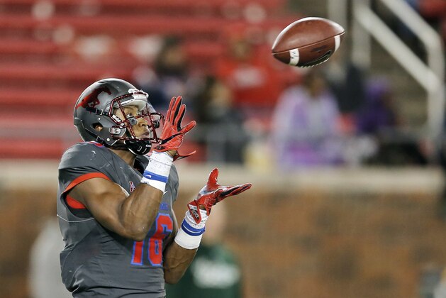 SMU wide receiver Courtland Sutton (16) catches a pass during the second half of an NCAA college football game Saturday, Nov. 19, 2016, in Dallas. Sutton ran the ball in for a touchdown on the play. South Florida won 35-27. (AP Photo/Brandon Wade)