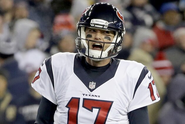 Houston Texans quarterback Brock Osweiler celebrates his touchdown pass to C.J. Fiedorowicz during the first half of an NFL divisional playoff football game against the New England Patriots, Saturday, Jan. 14, 2017, in Foxborough, Mass. (AP Photo/Steven Senne)