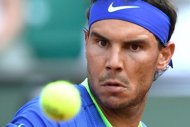 Spain's Rafael Nadal eyes the ball during his tennis match against Netherlands' Robin Haase at the Roland Garros 2017 French Open on May 31, 2017 in Paris.  / AFP PHOTO / Eric FEFERBERG        (Photo credit should read ERIC FEFERBERG/AFP/Getty Images)