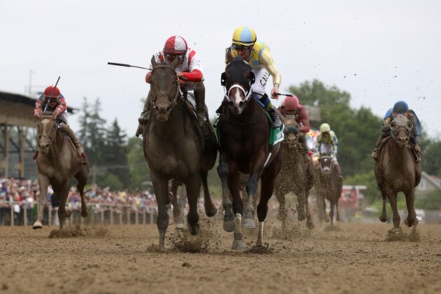 BALTIMORE, MD - MAY 20:  Cloud Computing #2 ridden by Javier Castellano (L) beats Classic Empire #5 ridden by Julien Leparoux to win the 142nd Preakness Stakes at Pimlico Race Course on May 20, 2017 in Baltimore, Maryland.  (Photo by Rob Carr/Getty Images)