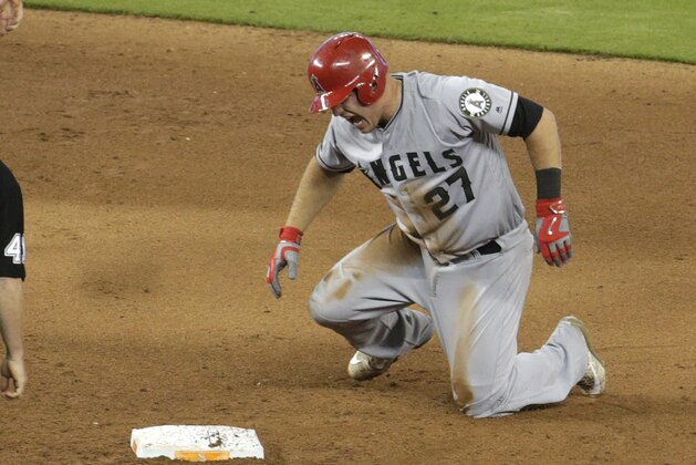 Los Angeles Angels' Mike Trout (27) reacts after stealing second during the fifth inning of an interleague baseball game against the Miami Marlins, Sunday, May 28, 2017, in Miami. Trout injured his thumb on the play. (AP Photo/Lynne Sladky)