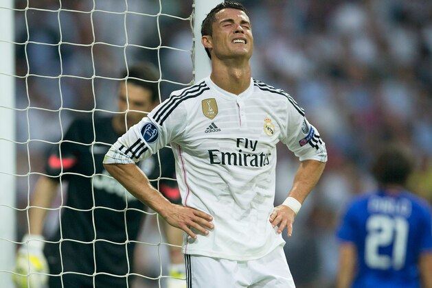 MADRID, SPAIN - MAY 13:  Cristiano Ronaldo of Real Madrid reacts after a missed chance on goal during the UEFA Champions League Semi Final, second leg match between Real Madrid and Juventus at Estadio Santiago Bernabeu on May 13, 2015 in Madrid, Spain.  (Photo by Gonzalo Arroyo Moreno/Getty Images)