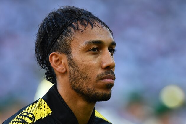 Dortmund's Gabonese forward Pierre-Emerick Aubameyang looks on prior the German Cup (DFB Pokal) final football match Eintracht Frankfurt v BVB Borussia Dortmund at the Olympic stadium in Berlin on May 27, 2017. / AFP PHOTO / Christof STACHE / RESTRICTIONS: ACCORDING TO DFB RULES IMAGE SEQUENCES TO SIMULATE VIDEO IS NOT ALLOWED DURING MATCH TIME. MOBILE (MMS) USE IS NOT ALLOWED DURING AND FOR FURTHER TWO HOURS AFTER THE MATCH. == RESTRICTED TO EDITORIAL USE == FOR MORE INFORMATION CONTACT DFB DIRECTLY AT +49 69 67880

 /         (Photo credit should read CHRISTOF STACHE/AFP/Getty Images)
