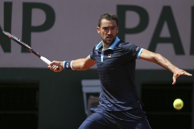 Croatia's Marin Cilic plays a shot against Russia's Konstantin Kravchuk during their second round match of the French Open tennis tournament at the Roland Garros stadium, in Paris, France. Thursday, June 1, 2017. (AP Photo/David Vincent)