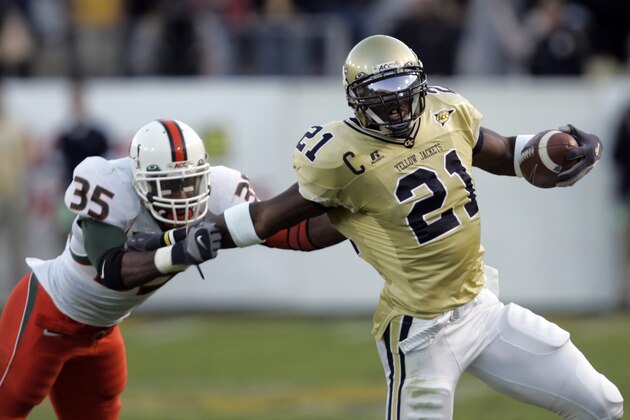 Georgia Tech receiver Calvin Johnson (21) tries to break free from Miami's Lovon Ponder (35) after a catch in the fourth quarter of a football game in Atlanta, Saturday, Oct. 28, 2007.  Georgia Tech won 30-23. (AP Photo/John Bazemore)