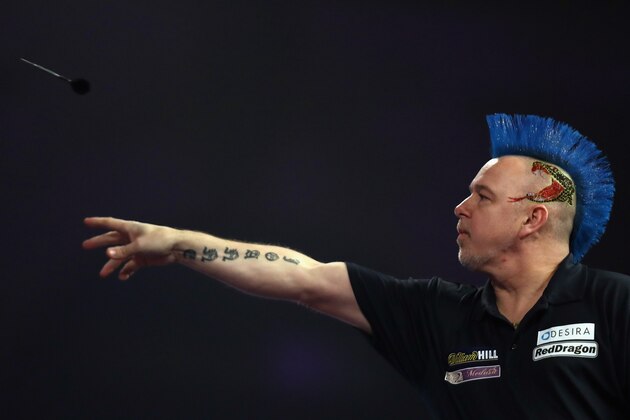 LONDON, ENGLAND - JANUARY 01:  Peter Wright of Great Britain throws against Gary Anderson of Great Britain during their semi-final match on day fourteen of the 2017 William Hill PDC World Darts Championships at Alexandra Palace on January 1, 2017 in London, England.  (Photo by Bryn Lennon/Getty Images)